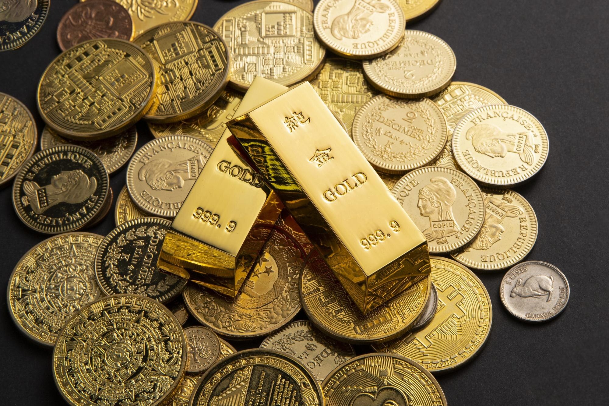 Gold bars being weighed, representing Deep Rock Mining's operations.